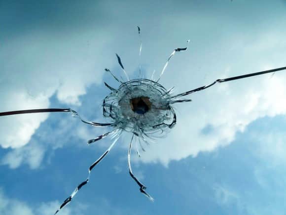 Bullet Cracks Glass