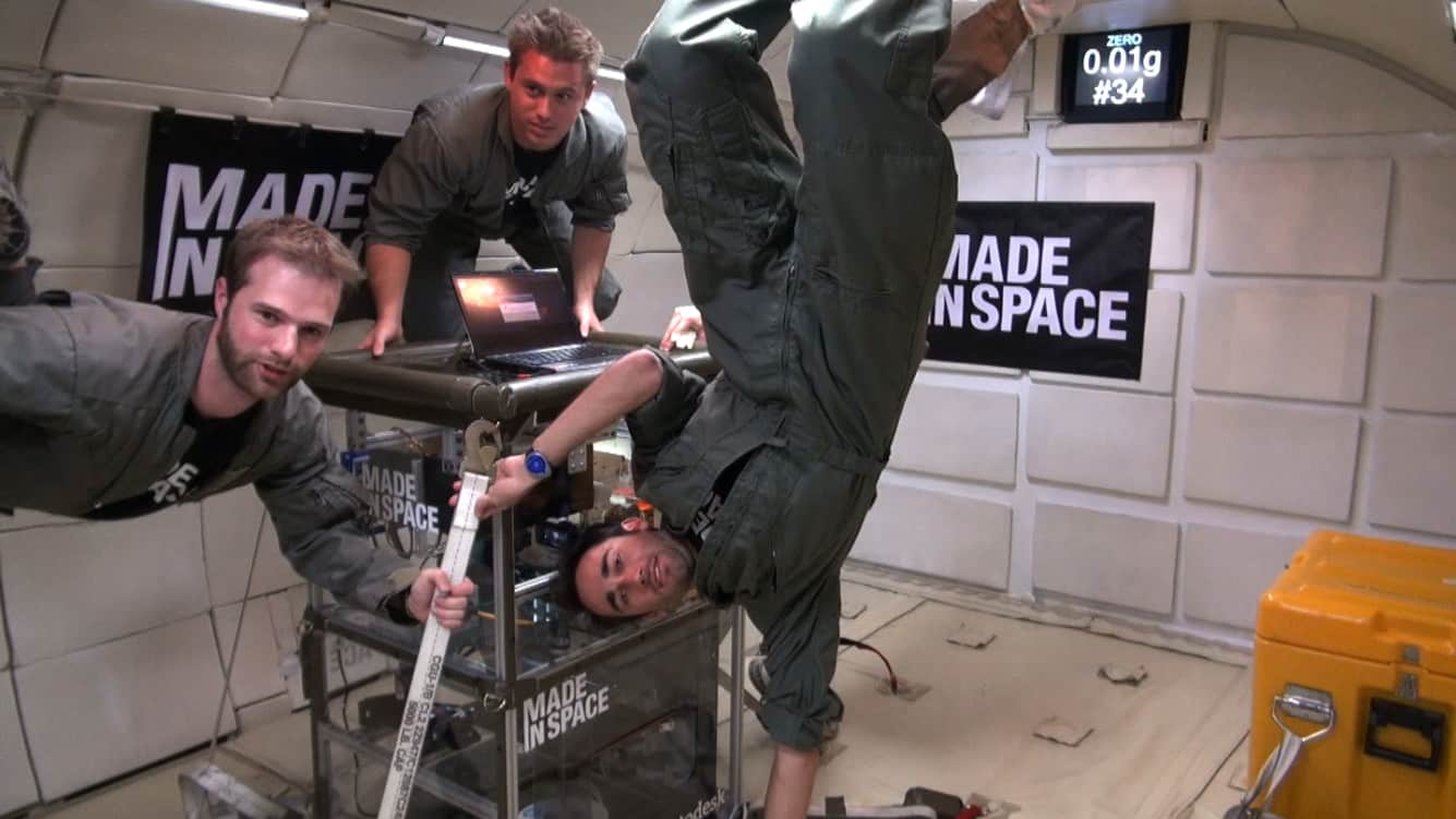 People With 3-D Printer Hanging On A Zero Gravity Test Flight