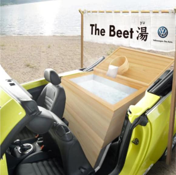 Volkswagen Beetle With Bathtub In Its Backseat