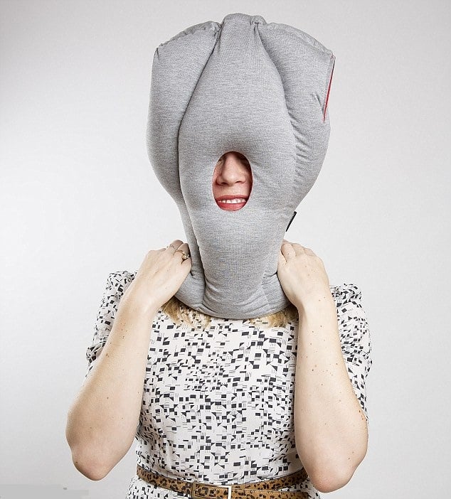 A Lady Covered Her Head And Face With Ostrich Pillow