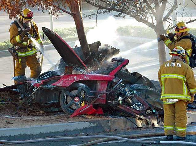 Firefighters Spray Water On Crashed Porsche Car