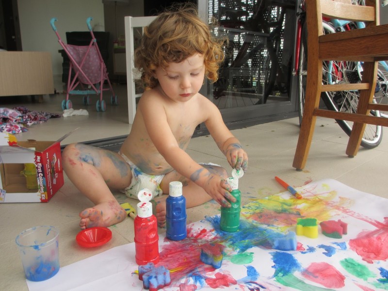 Child Playing At Home With Colors
