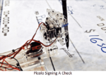 Sign Your Check By A Robot Artist: Piccolo