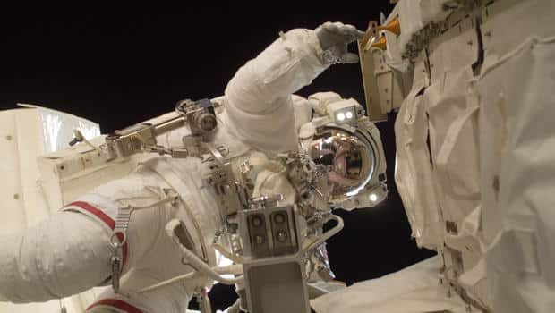 Astronaut Outside Spacecraft In Space